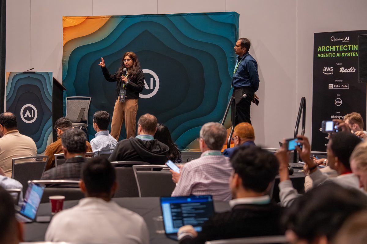 A speaker presenting in a breakout room on the teal stage