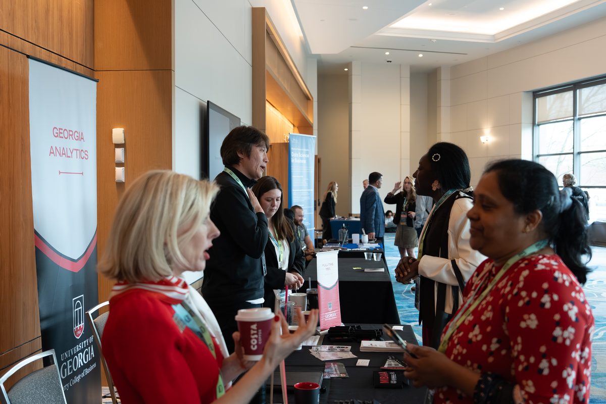 University of Georgia representatives talking with attendees